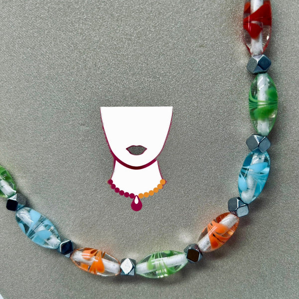 Colorful beaded necklace on a gray background with a small illustration of a face wearing a bonnet.