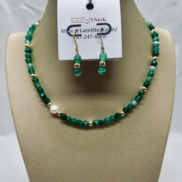 Green beaded necklace and earrings on a mannequin bust with Laced4Neck label.