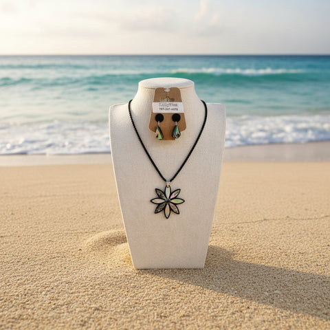 Black necklace and earrings set on a mannequin bust with a visible brand tag.