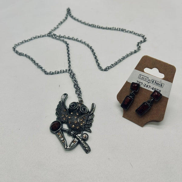 Necklace with pendant and earrings on a white background