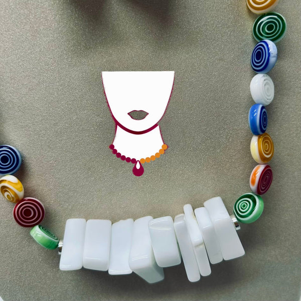 Necklace with white beads and colorful spiral accents on a beige background
