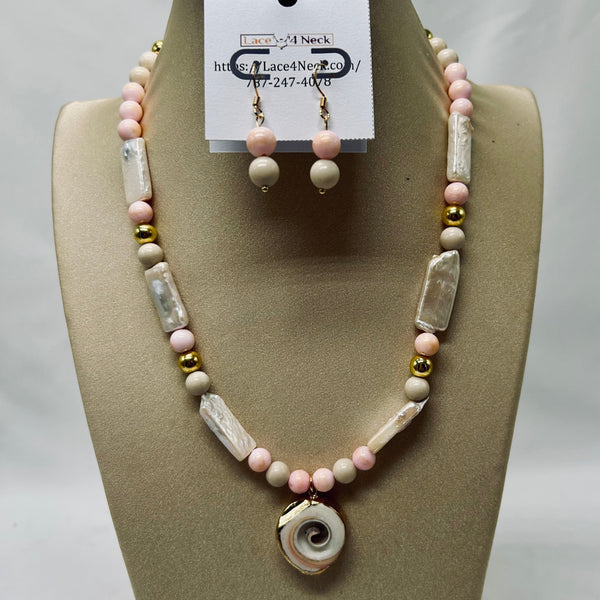 Necklace and earrings set on a mannequin bust with a visible brand tag.