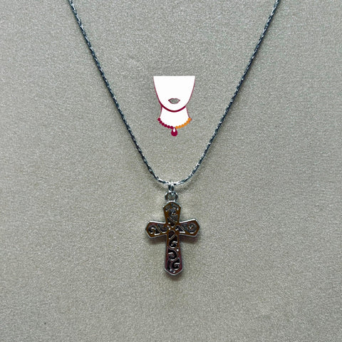 Cross pendant necklace on a gray background