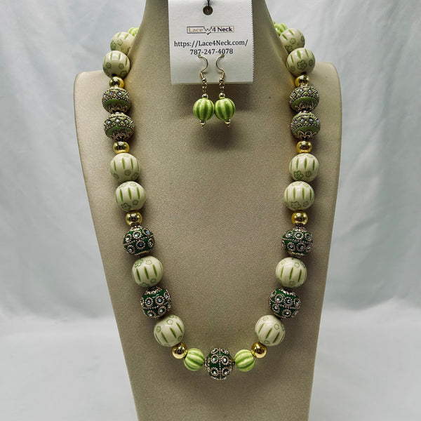 Necklace and earrings set on a mannequin with a visible brand tag.