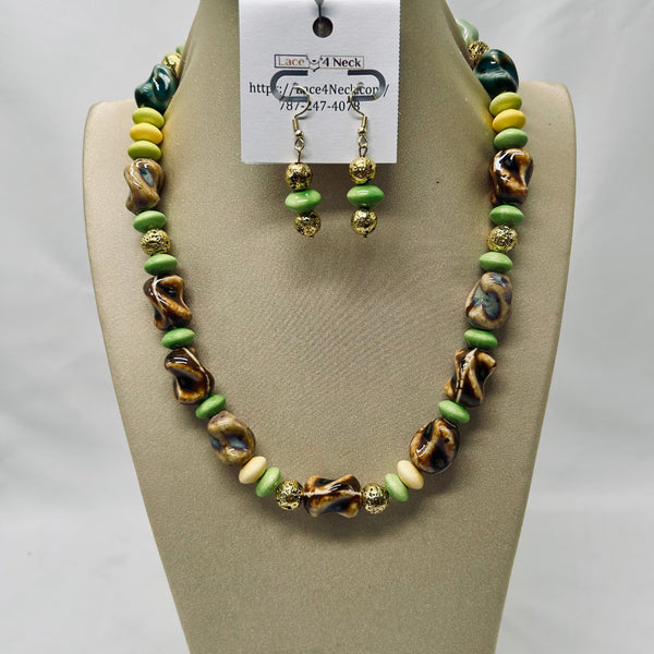 Necklace and earrings set on a beige display with a visible brand tag.