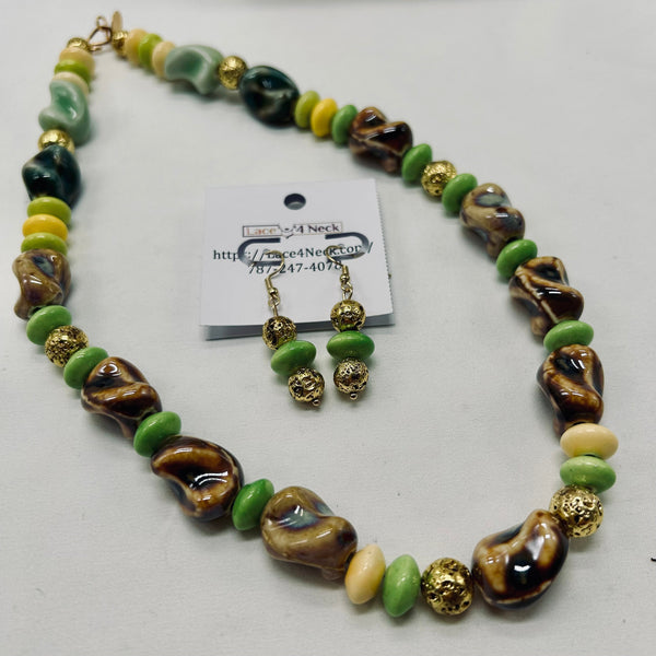 Necklace and earrings set with green, brown, and gold beads on a white background