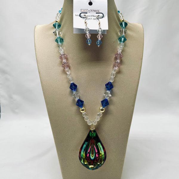 Necklace and earrings set on a mannequin bust with a visible brand tag.