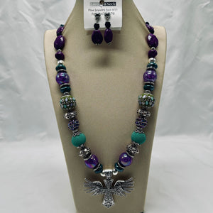 Jewelry set with necklace and earrings on a display stand