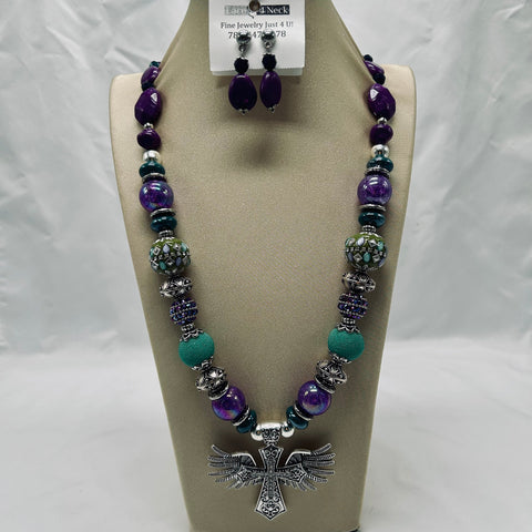 Jewelry set with necklace and earrings on a display stand
