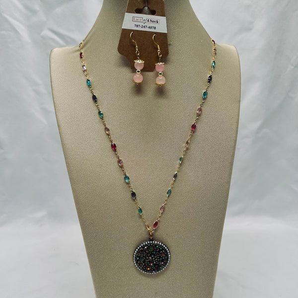 Necklace and earrings set on a mannequin bust with a white background