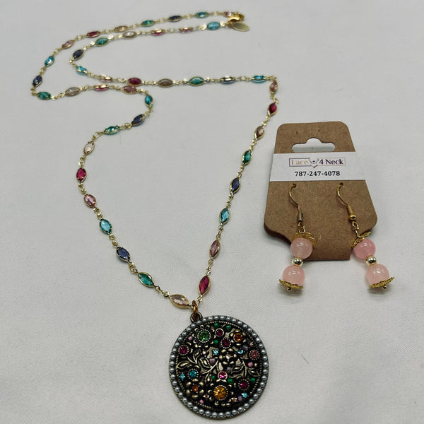 Jewelry set with necklace and earrings on a gray background