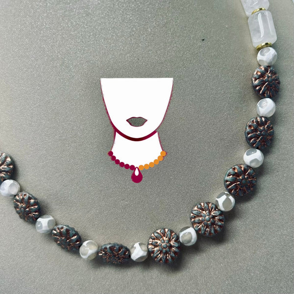 A beaded necklace with faceted white beads, textured metallic bronze flower-shaped beads, and a central graphic of a white neck with a red and orange beaded necklace, displayed on a gray textured background.