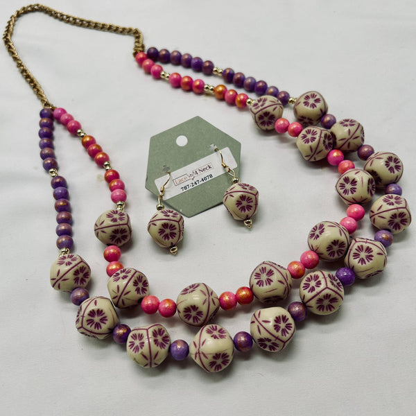 Beaded necklace with floral patterns on a white background
