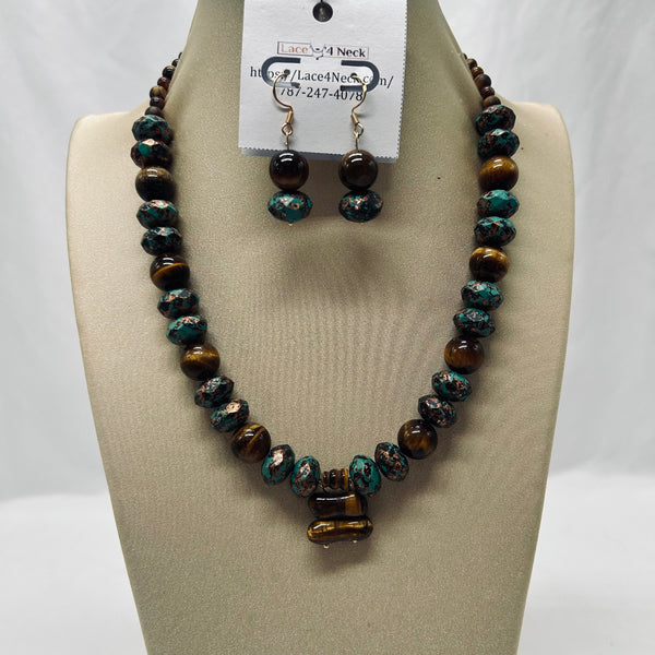 Beaded necklace and earrings set on a mannequin bust with a visible brand tag.
