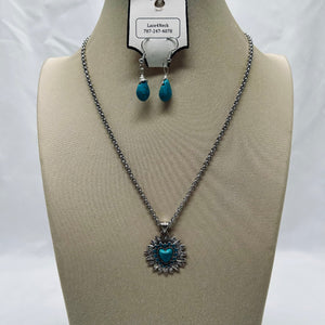 Jewelry set with necklace and earrings on a mannequin bust against a white background