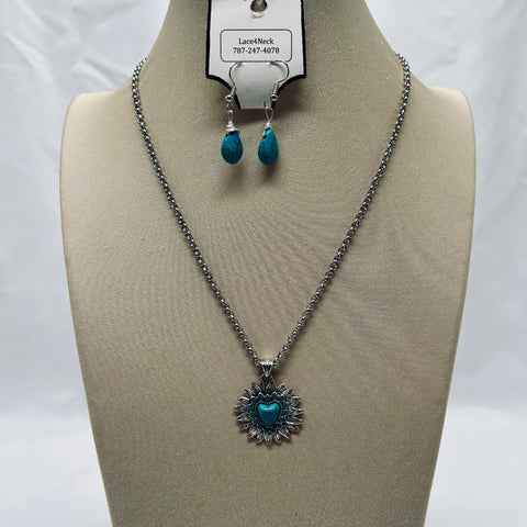 Jewelry set with necklace and earrings on a mannequin bust against a white background