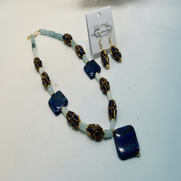 Jewelry set with necklace and earrings on a white background