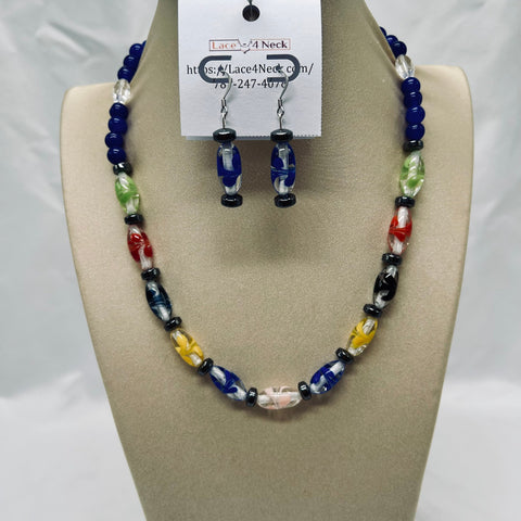 Beaded necklace and earrings set on a mannequin bust with a visible brand card.
