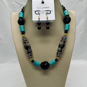 Jewelry set with necklace and earrings on a display stand