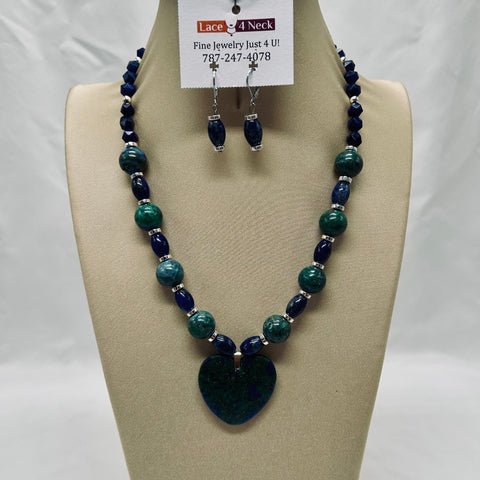 Necklace and earrings set on a mannequin bust with a visible brand tag.