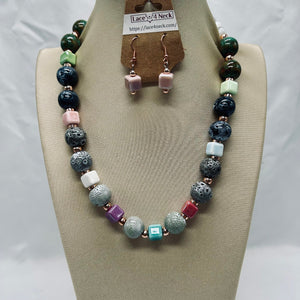 Necklace and earrings set on a mannequin bust with 'Lace & Neck' branding.