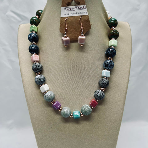 Necklace and earrings set on a mannequin bust with 'Lace & Neck' branding.