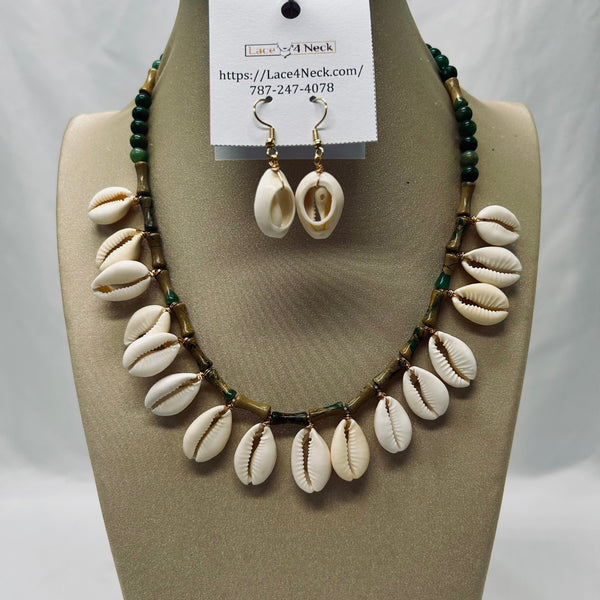 Jewelry set with shell necklace and earrings on a mannequin bust, with a visible brand tag.