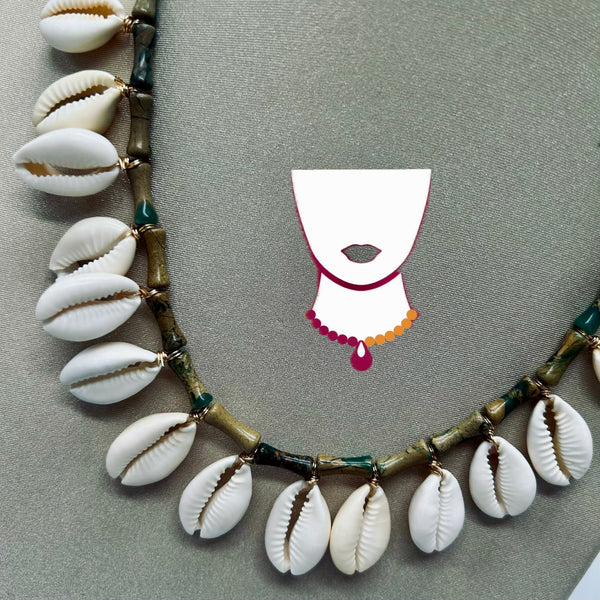Necklace with shell pendants on a gray background