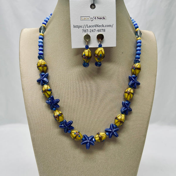 Necklace and earrings set on a mannequin bust with a visible brand tag.