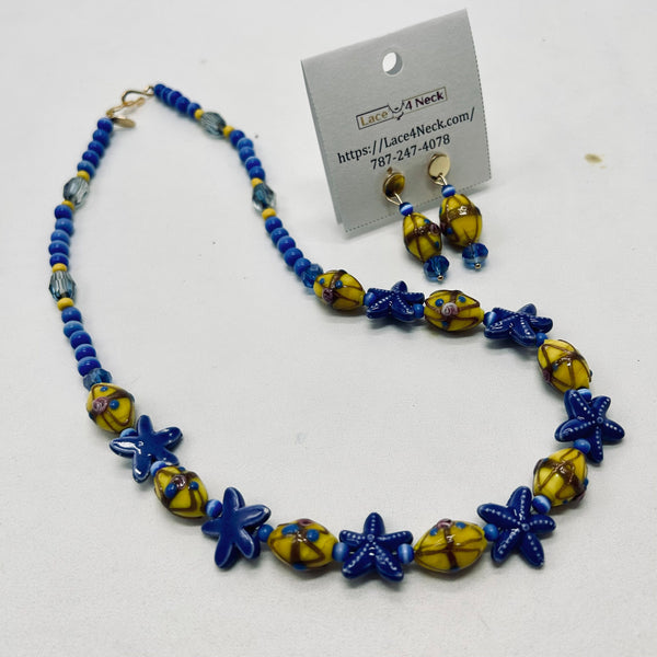 Necklace and earrings set with blue and yellow beads on a white background