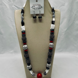 Jewelry set with necklace and earrings on a display card