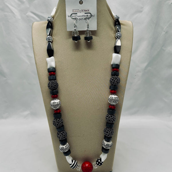 Jewelry set with necklace and earrings on a display card