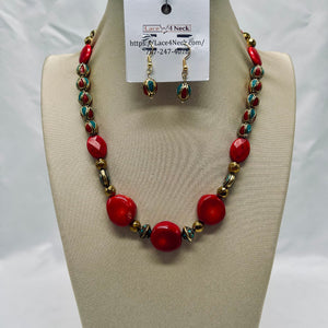 Necklace and earrings set on a mannequin bust with a visible brand tag.
