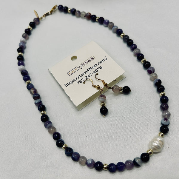 Beaded necklace and earrings set with a card on a white background