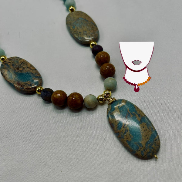 Necklace with large oval stones and smaller beads on a gray background