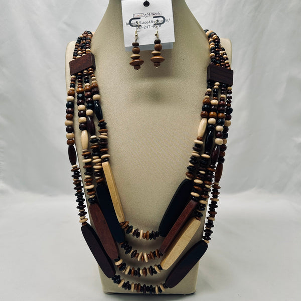 Necklace and earrings set on a mannequin bust with a white background
