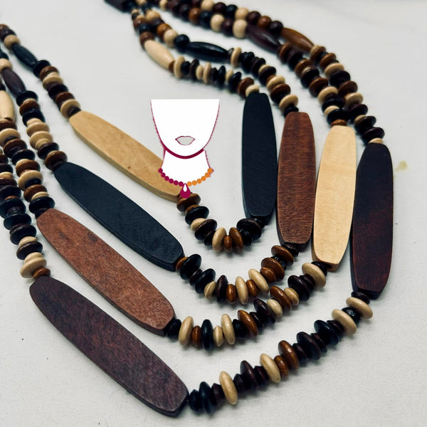 Necklace with wooden and beaded elements on a white background
