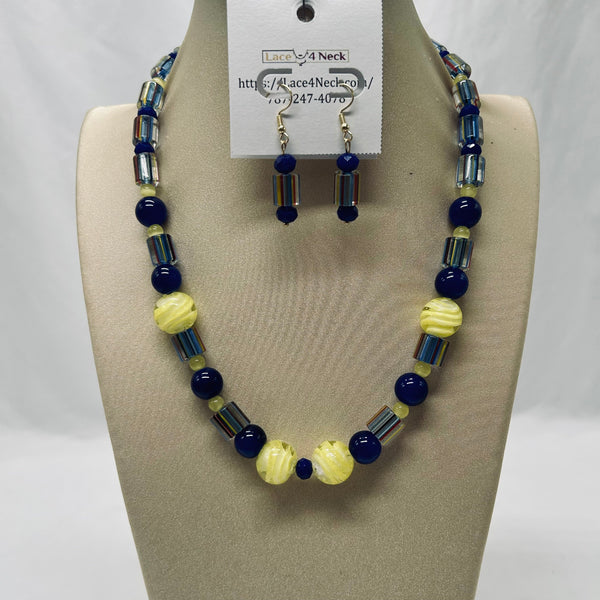 Beaded necklace and earrings set on a mannequin with a visible brand tag.