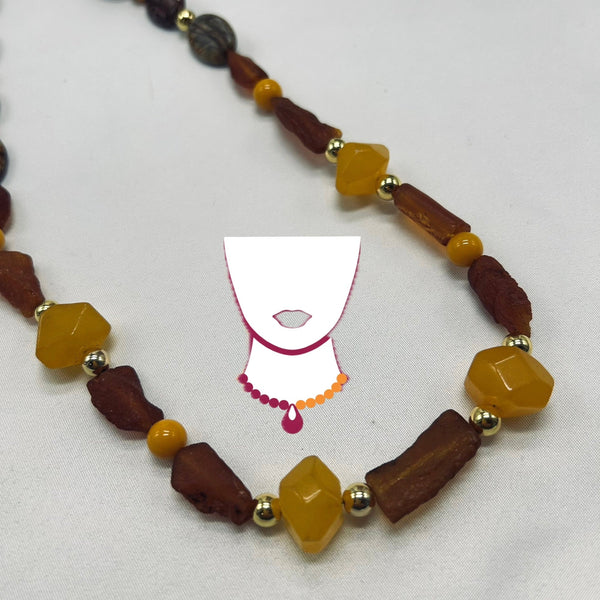 Necklace with brown and yellow beads on a white background