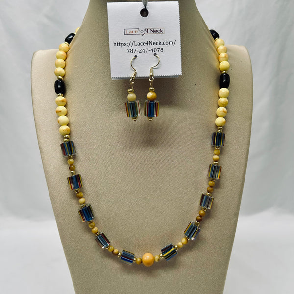Beaded necklace and earrings set on a mannequin bust with a visible brand tag.