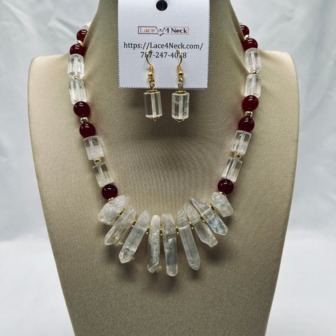 Necklace and earrings set on a mannequin bust with a visible brand card.