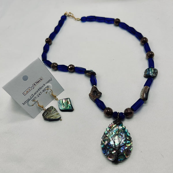 Jewelry set with blue beaded necklace and matching earrings on a white background