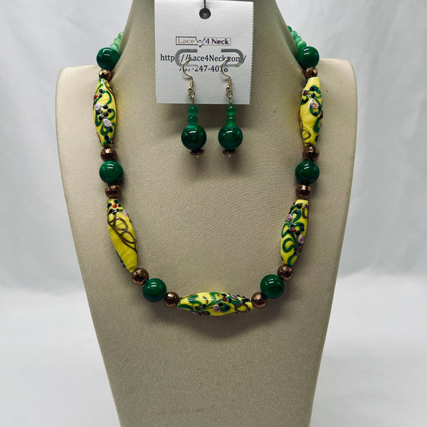 Jewelry set with necklace and earrings on a display stand