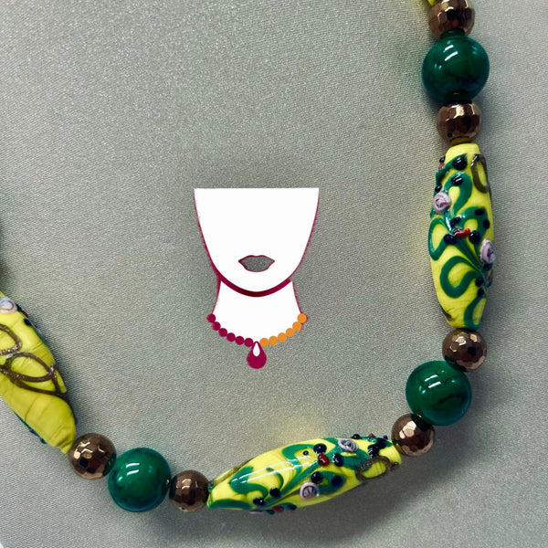 Colorful beaded necklace with decorative beads on a gray background