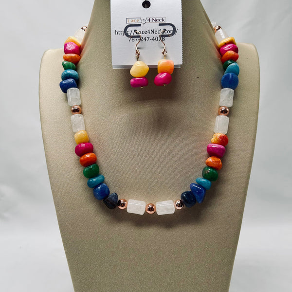 Colorful beaded necklace and earrings on a mannequin bust with a visible brand tag.