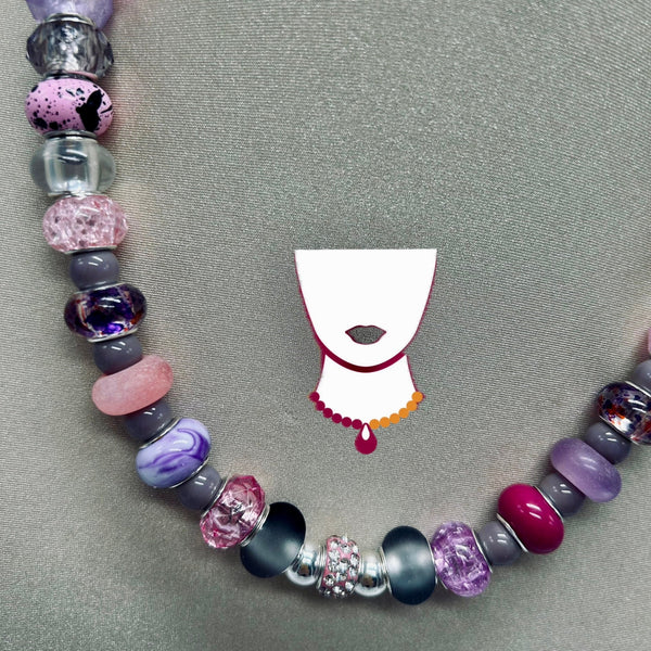 Beaded bracelet with colorful beads on a gray background