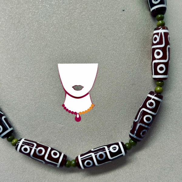 Necklace with patterned beads on a gray background