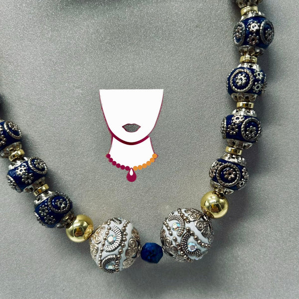 Decorative beaded necklace with blue, gold, and silver beads on a gray background.