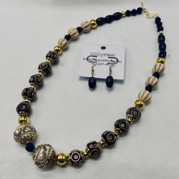 Beaded necklace and earrings set with a card on a white background