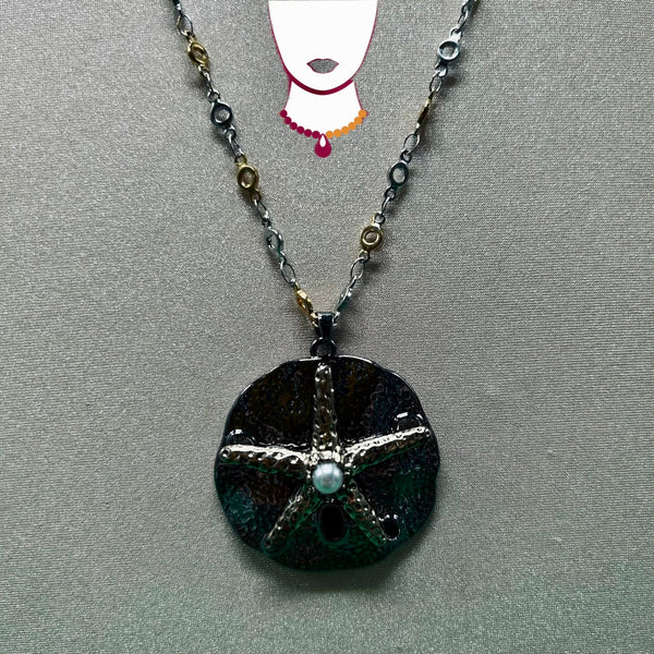 Necklace with a round pendant on a gray background